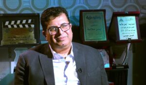 (أيمن سلامة): (أحمد عز) فارس الإذاعة الذي يبحث عن أموال جده في (أغني رجل في العالم)
